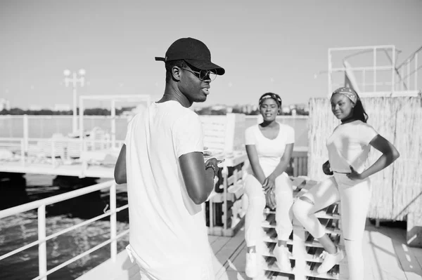 Stylish african american boy, wear on white clothes, glasses and