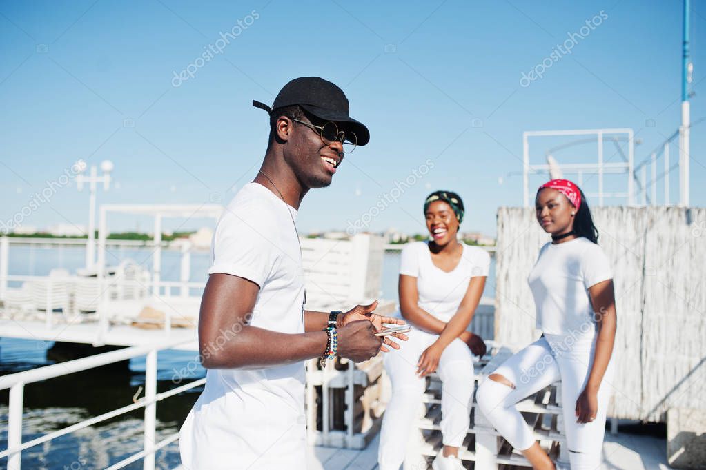 Stylish african american boy, wear on white clothes, glasses and