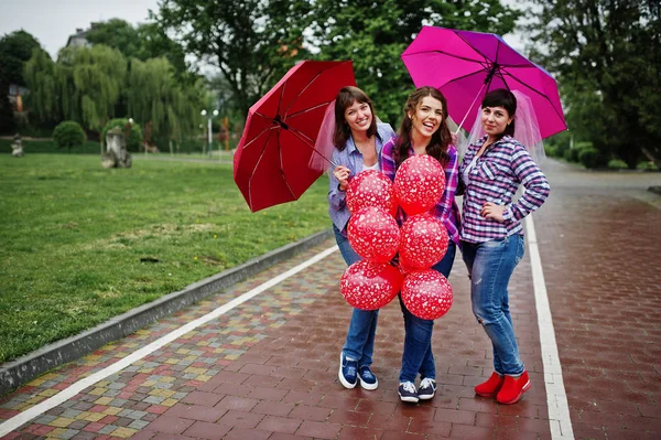 Group of three girls having fun at hen party, with umbrella unde — Stock Photo, Image