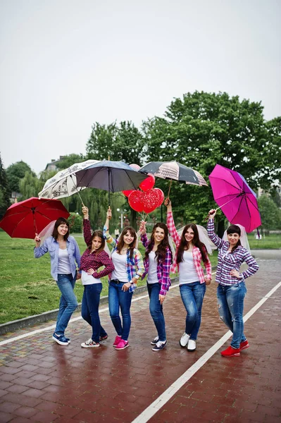 Group of six girls having fun at hen party, with umbrella under — Stock Photo, Image