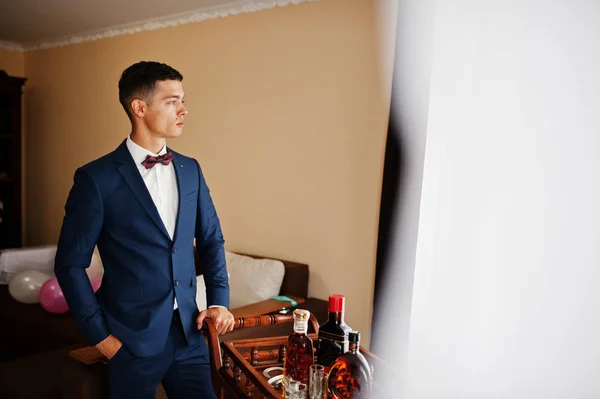 Portrait of a groom posing for his wedding photo session in his — Stock Photo, Image