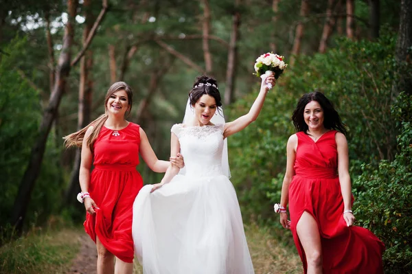 Fantastic bride with awesome bridesmaids having fun in the fores — Stock Photo, Image
