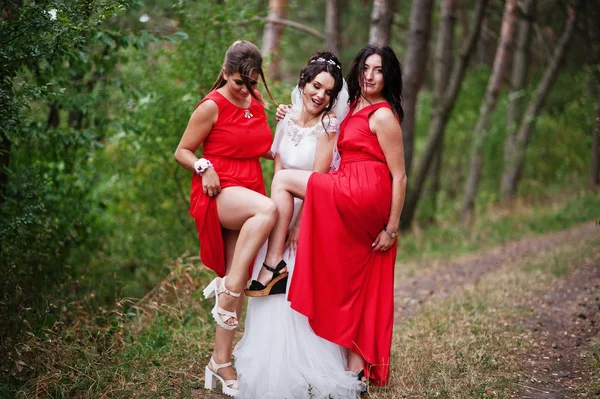 Fantastic bride with awesome bridesmaids having fun in the fores — Stock Photo, Image