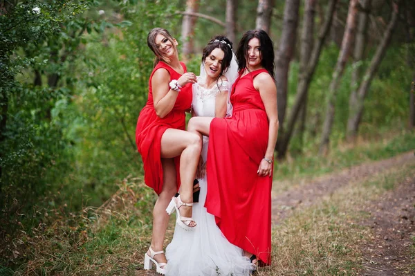 Fantastic bride with awesome bridesmaids having fun in the fores — Stock Photo, Image