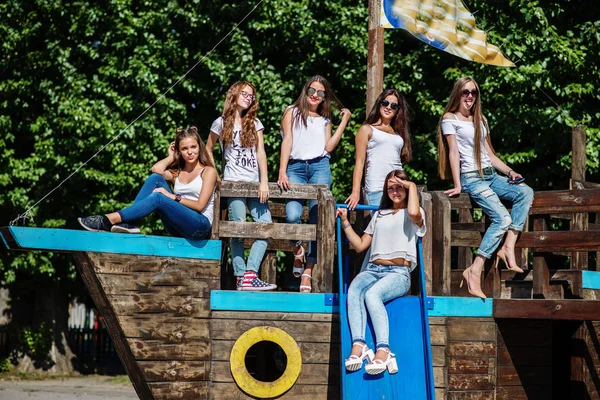 Six fabulous girl faving fun posing on a childish wooden ship in — Stock Photo, Image