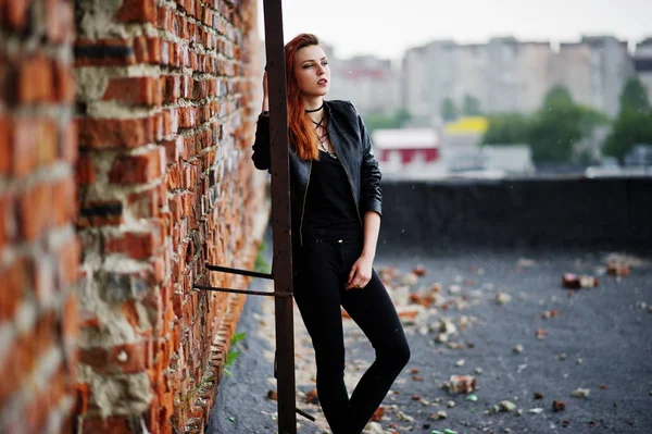 Red haired punk girl wear on black at the roof against brick wal — Stock Photo, Image