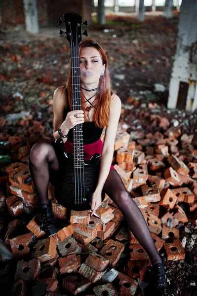 Red haired punk girl wear on black and red skirt, with bass guit — Stock Photo, Image