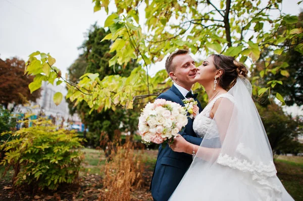 Good-looking newly married couple walking and enjoying each othe