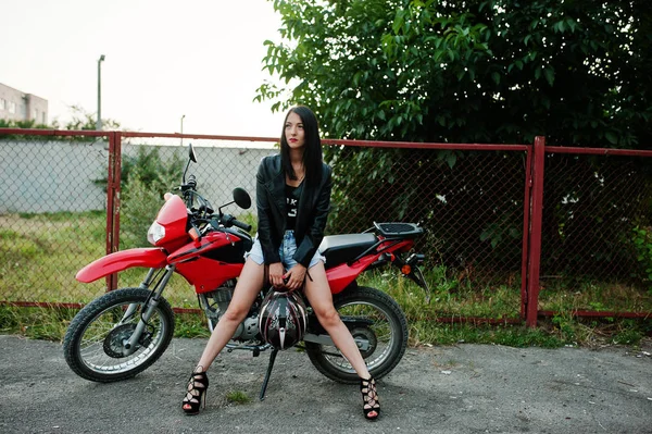 Portrait of a cool and awesome woman in dress and black leather — Stock Photo, Image