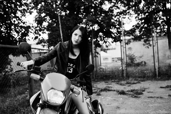 Portrait of a cool and awesome woman in dress and black leather — Stock Photo, Image