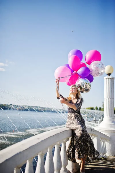 Girl blonde with balloons at hen party against lake. — Stock Photo, Image