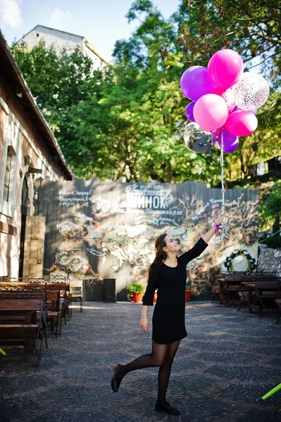 Girl wear on black with balloons at hen party. — Stock Photo, Image