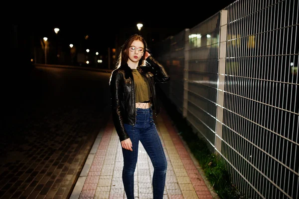Night portrait of girl model wear on jeans and leather jacket ag