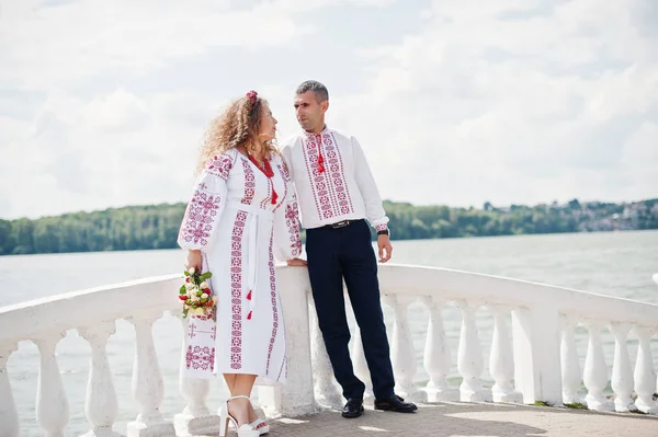 Fantastic wedding couple in ukrainian traditional embroidered cl