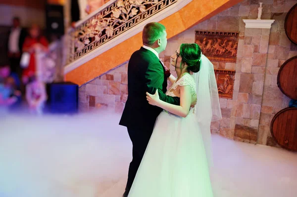 Happy young wedding couple dancing their first dance with differ — Stock Photo, Image