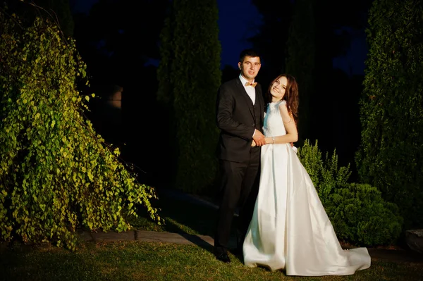 Wedding couple hugs at evening in love. — Stock Photo, Image