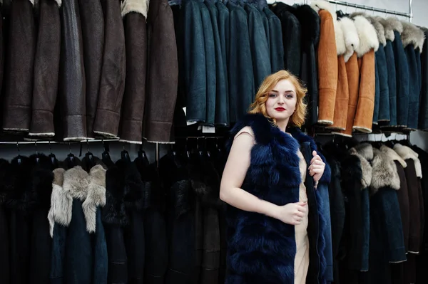 Elegance blonde girl in fur coat at the store of fur coats and l — Stock Photo, Image
