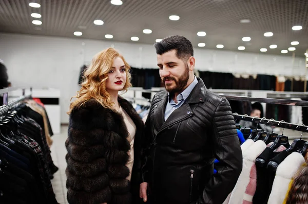 Elegance blonde girl in fur coat and stylish turkish man at the — Stock Photo, Image