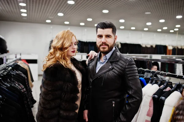 Elegance blonde girl in fur coat and stylish turkish man at the — Stock Photo, Image