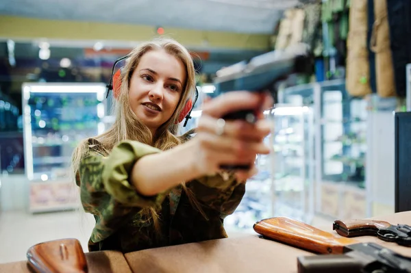 Shooting at the shooting range.The woman at the shooting range s