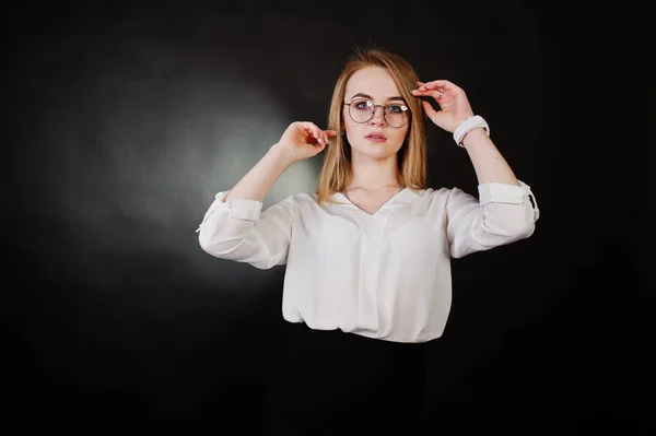 Studio portrait of blonde businesswoman in glasses, white blouse — Stock Photo, Image