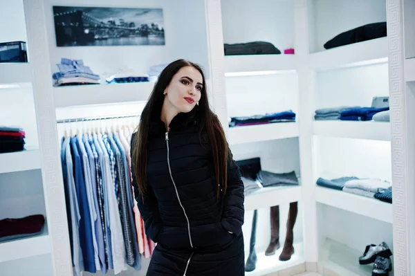 Brunette gorgeous girl in the clothing store boutique at winter — Stock Photo, Image