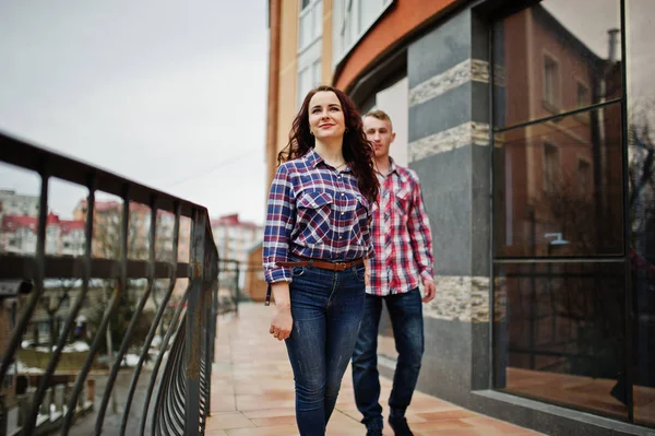 Stylish couple wear on checkered shirt in love together. — Stock Photo, Image