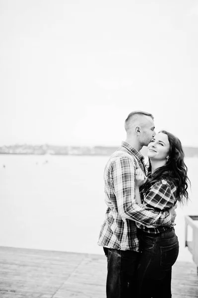 Stylish couple wear on checkered shirt in love together. — Stock Photo, Image