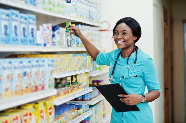 African american pharmacist working in drugstore at hospital pha — Stock Photo, Image