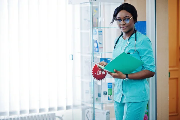 African american pharmacist working in drugstore at hospital pha — Stock Photo, Image