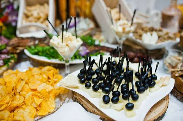 Table of wedding reception with delicious food, cheese and meat. — Stock Photo, Image