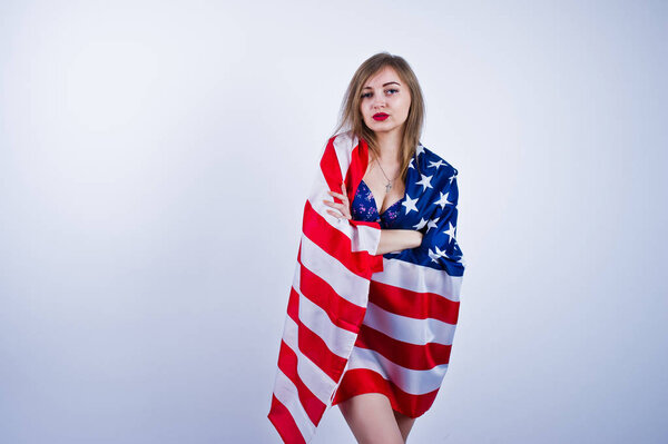 Cute girl in bra with american usa flag isolated on white backgr
