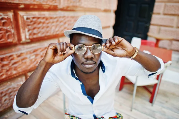 Stylish african american man in white shirt and colored pants wi — Stock Photo, Image