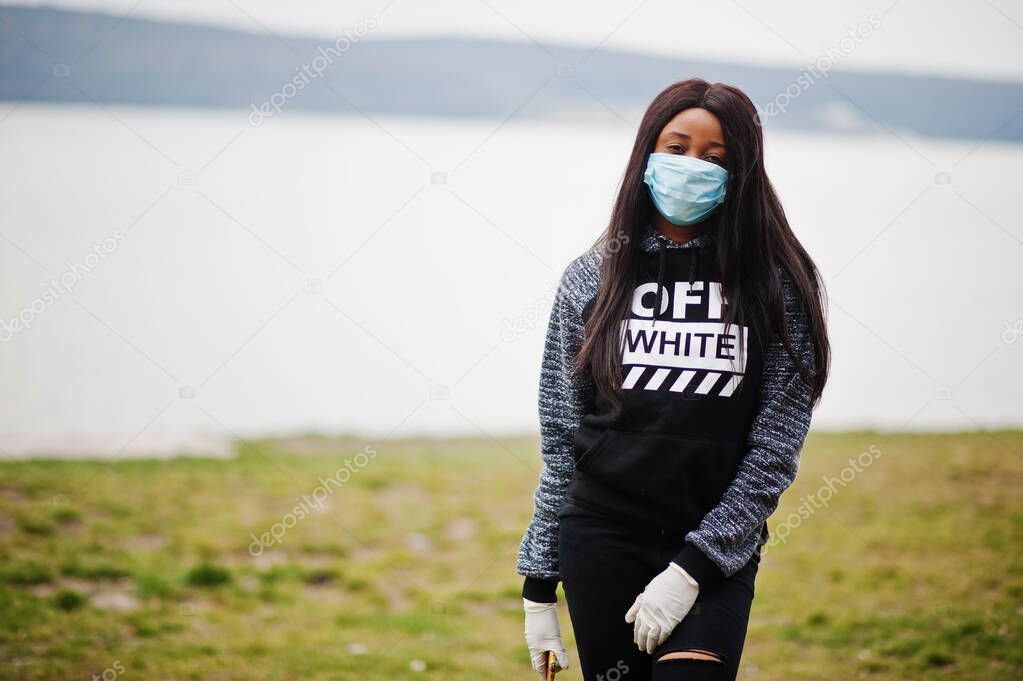 African girl at park wearing medical masks protect from infections and diseases coronavirus virus quarantine.