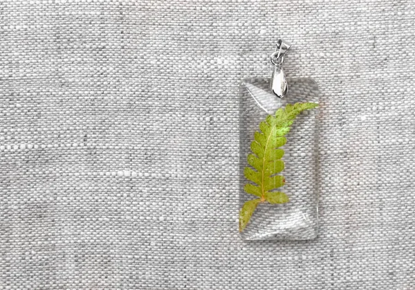 handmade epoxy resin jewelry. pendant, fern.
