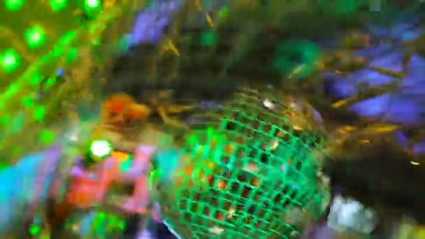 Multicolored light shimmers and reflects off the mirrored disco balls — Stock video