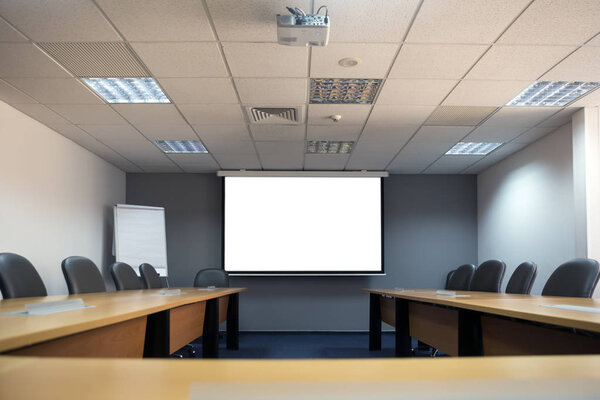 Mock up. White screen in conference room.