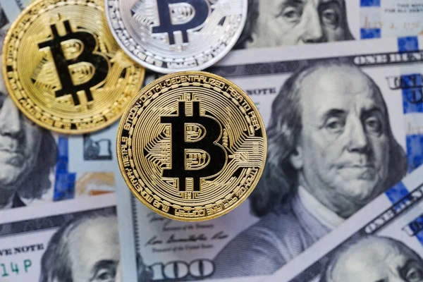 Bitcoins on money bills background — Stock Photo, Image