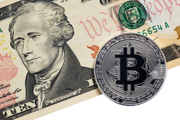 gümüş metal bitcoin ve on dolarlık banknot