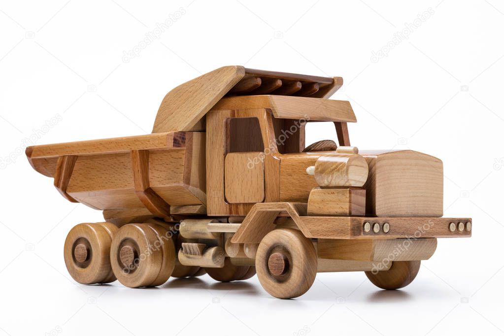 Wooden toy car on white background.