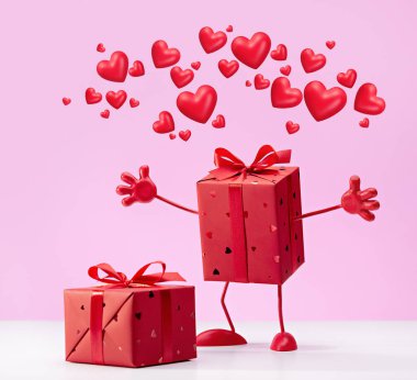 Pembe arka planda iki kırmızı hediye kutusu ve tebrik için fotokopi alanı. 14 Şubat için hediyen benim..