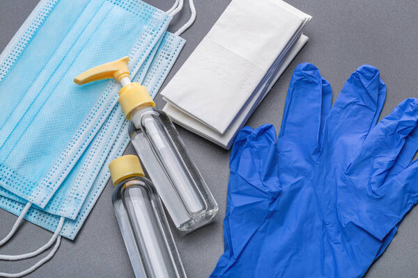  Средства профилактики. Дезинфицирующий спрей, бактерицидная салфетка, маска и перчатки. Студийный снимок, крупный план
.