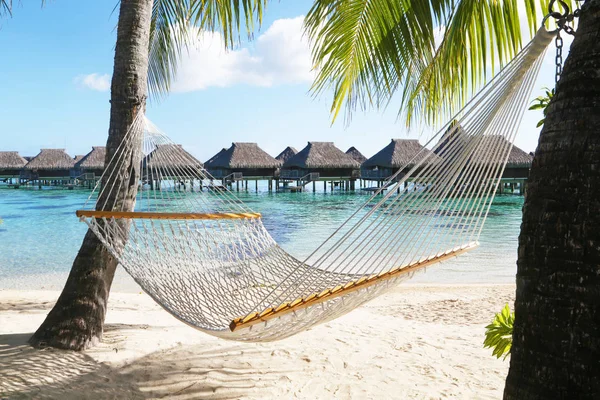 Hammock on tropical beach in Bora Bora, French Polynesia — Stock Photo, Image