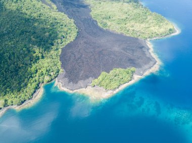 An old lava flow is seen on Banda Api in the Banda Islands of Indonesia. This tropical region, part of the Ring of Fire, is known for its extraordinary marine biodiversity. clipart