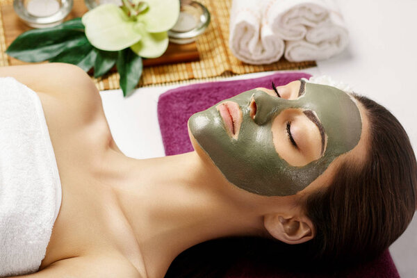 Face peeling mask, spa beauty treatment, skincare. Woman getting