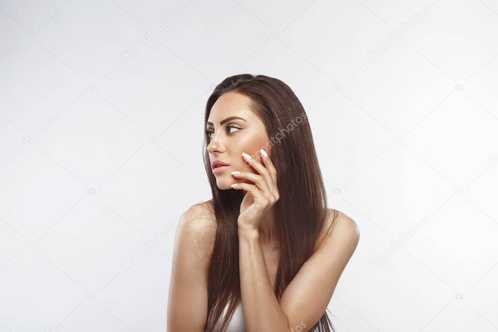 Beautiful woman portrait, skin care concept, beautiful skin. Portrait of female hands with manicure nails. Copyspace