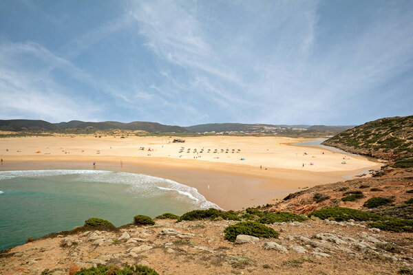 Surfer on surfboards at Praia da Bordeira near Carrapateira, Beach and Surf spot, Algarve Portugal