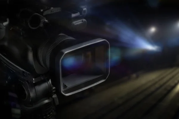 professional video camcorder in studio with blurred background