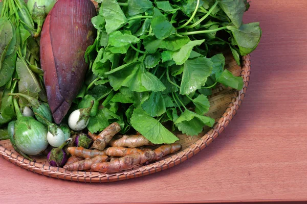 Thai vegetable, food ingredients and herbs in rattan basket on w — Stock Photo, Image
