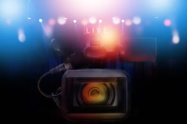 professional video camcorder with set of light hanging in televi